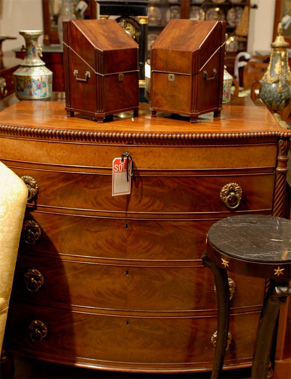 A pair of mahogany knife boxes with fitted interiors, brass hardware, and canted fluted corners.  Originating from England, or possibly France, during the first quarter of the 19th century.

William Word Fine Antiques: Atlanta's source for antique