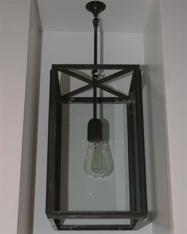 Handmade brass and glass hanging lantern with single bulb. Featured in Weathered Brass. Other finishes available. See complete line at www.circantiques.net
