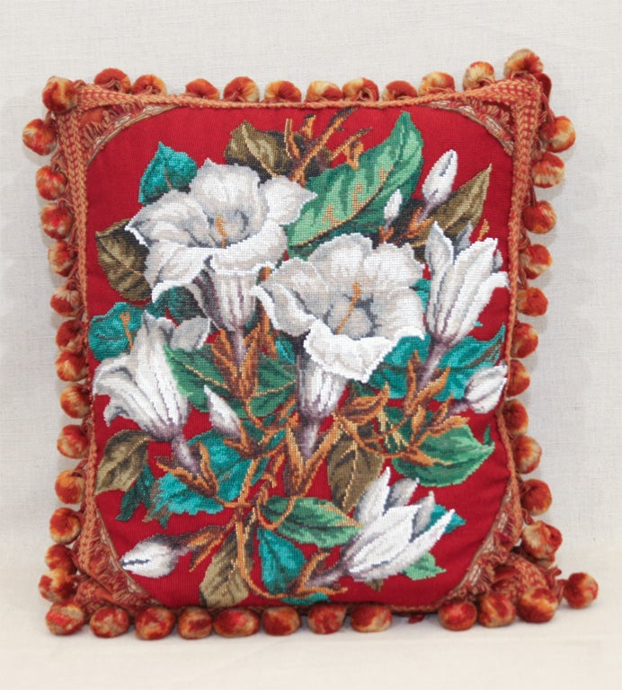 Victorian Needlepoint and Beadwork Pillows in Various Floral Designs on Red Ground with Silk Fringe and Velvet Backing.  Priced Individually.   England, c. 1875.<br />
<br />
Each Pillow Approximately: 19 inches x 15 inches