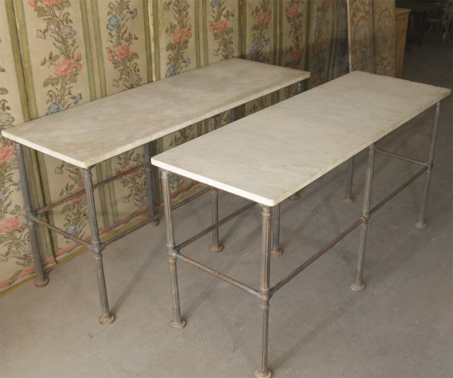 Pair of baker's display tables circa 1850.  Iron legs with detail.  Marble top.  Two available, priced individually.