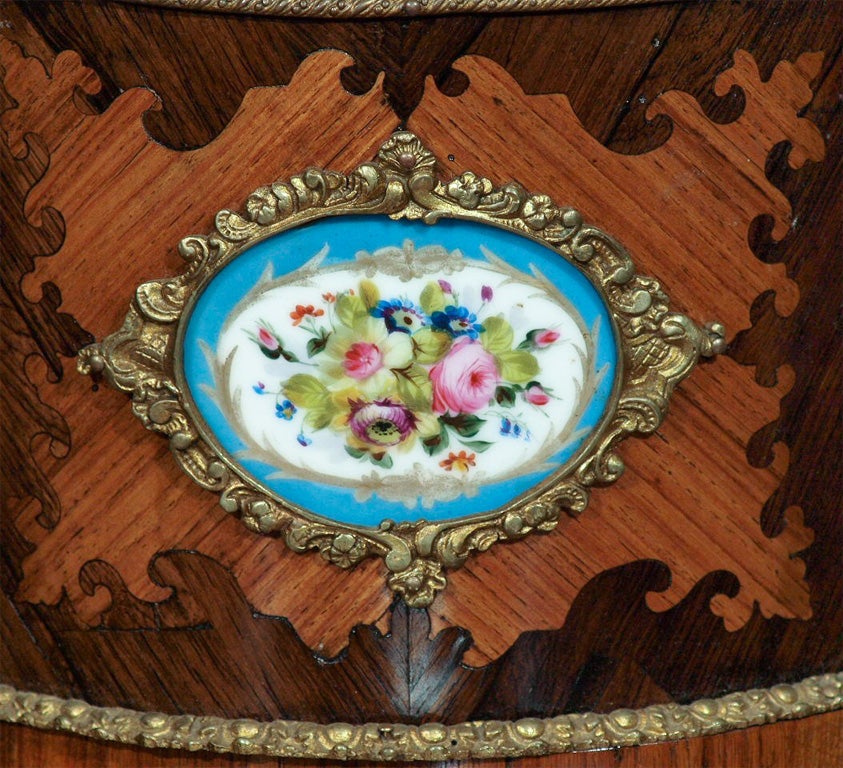 19th c Kingwood and rosewood with ormolu mounts and sevres plaque jardiniere with tin liner.
