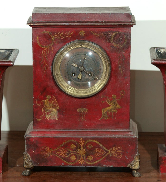 Early 19th c Red Tole Clock and two garniture vases. Vases are 6.5sq. x 10