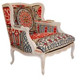 Antique Louis XV begere upholstered in vintage Egyptian fabric