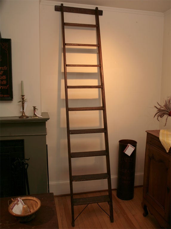 Tall, handsome and very functional is a good way to describe this early French library ladder . It is wide and very sturdy.It was originally used as a library ladder in the Brittany area of France