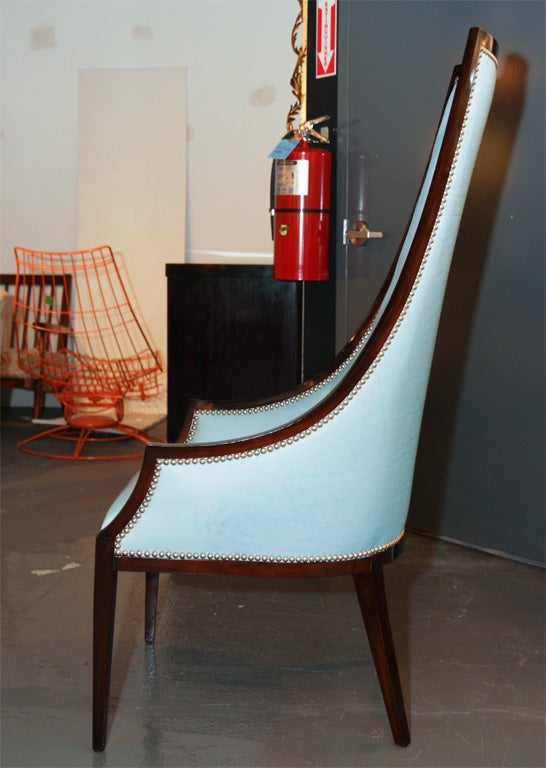 Exceptional pair of 1950's mahogany framed chairs featuring new sky blue tufted leather upholstery and nickel nailhead detail. Visit QUOTIENTNYC.com to view our entire collection.