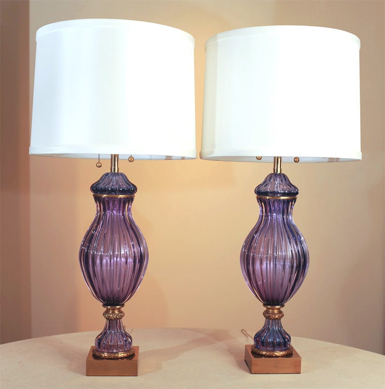 These are so over the top elegant and, at over three feet tall, quite imposing.  The color is best described as violet/purple.  This pair was made in Italy for The Marbro Company about fifty years ago.  The glass is perfect still, the brass still