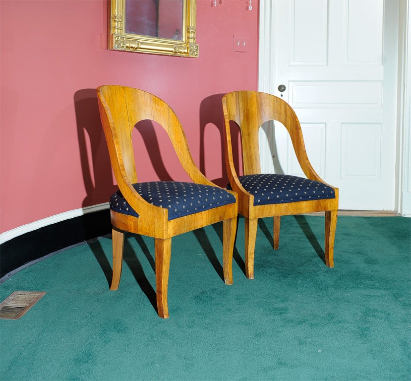 These chairs have a rich patina with a golden glow.  Timeless design.