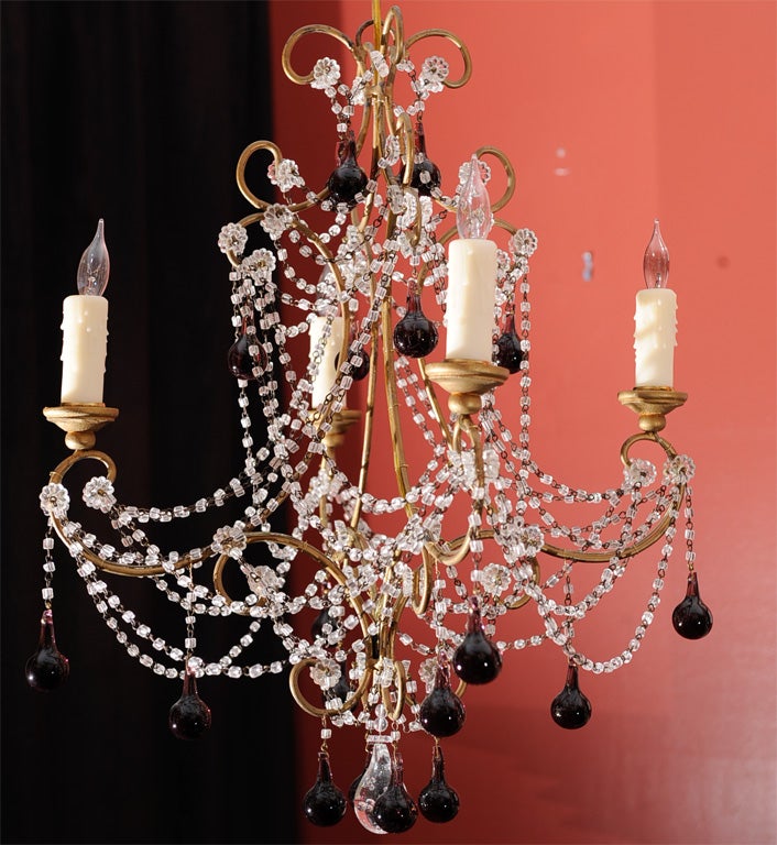 4-light metal frame formed into scrolls. Classic Italian beadwork with amethyst tear drops on antique pinning. Bottom finial teardrop is clear with bubbles.