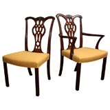 Set of twelve George III. style carved mahogany dining chairs