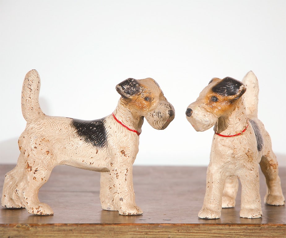 PAIR OF ORIGINAL PAINTED CAST IRON JACK RUSSEL TERRIORS/DOOR STOPS IN PRISTINE CONDITION.THIS IS A GREAT SET AND SMALL SCALE SIZE.SOLD AS A PAIR FOR 950..