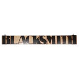19THC BLACKSMITH SIGN IN ORIGINAL PAINT W/ORIGINAL IRON  HANGERS