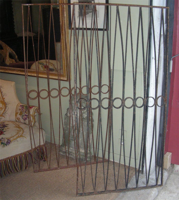 Two 19th century iron gates, one is in black patina.