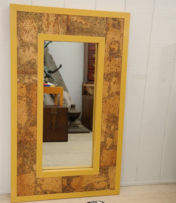 Striking yellow ochre lacquer mirror with patchwork cork inset.  Cork has great contrast and figuring.  Perfect for an entryway or powder room.