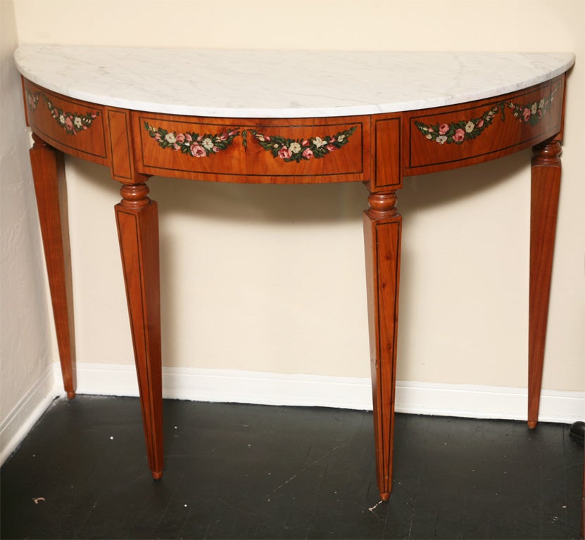 Pair of Adams painted marble top console tables; the white marble tops above a frieze painted with flowers.

After 43 years of business we are retiring. Everything must be sold. Many of the pieces listed here on 1stdibs represent markdowns below