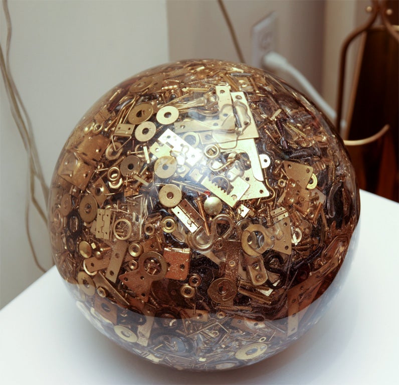 Resin spheres composed of miscellaneous vintage hardware parts.