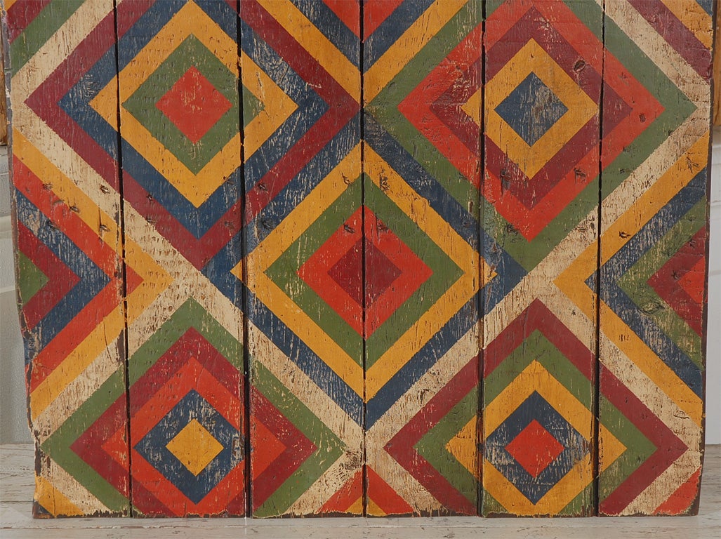 Bold geometric abstract painted board found in Texas. We have a collection of these boards from an anonymous artist who painted on recyled cupboard doors, table tops, stool tops and bread boards. Very dynamic when hung in collections. Other boards