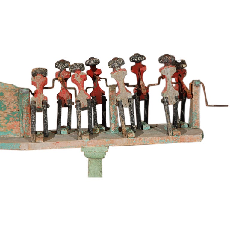 Amazing eight man assembly line whirligig. Attributed to an auto worker in Detroit. Fantastic original dry paint surface. Crank turns and figures move perfectly.