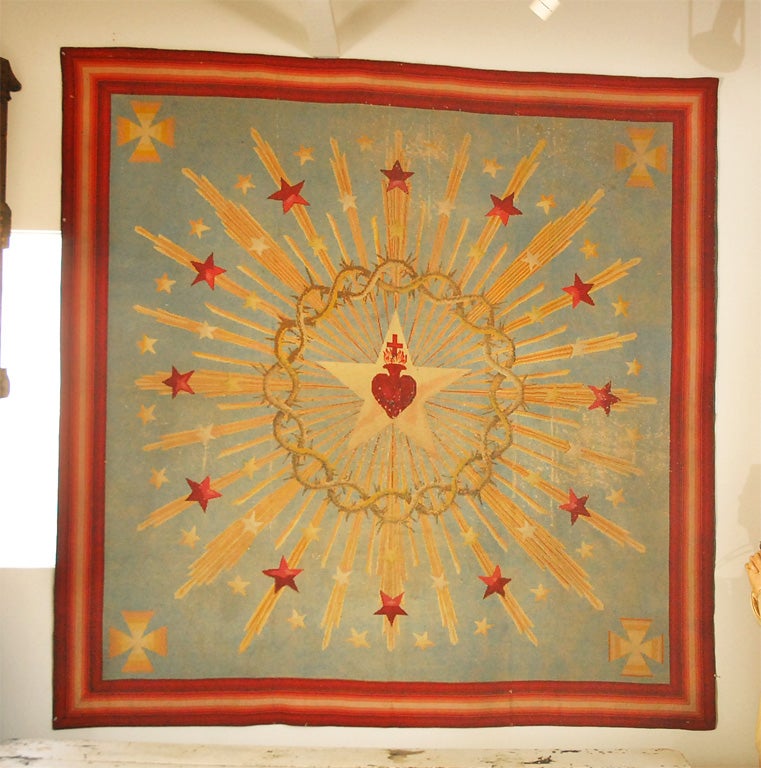 Dynamic large scale religious needlework wall hanging or rug found in New Orleans. Explosive depiction of the sacred heart surrounded by a crown of thorns and shooting stars.