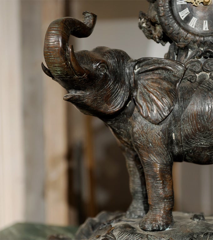 Metal Whimsical metal figural Clock, Monkey w/ parasol riding Elephant For Sale