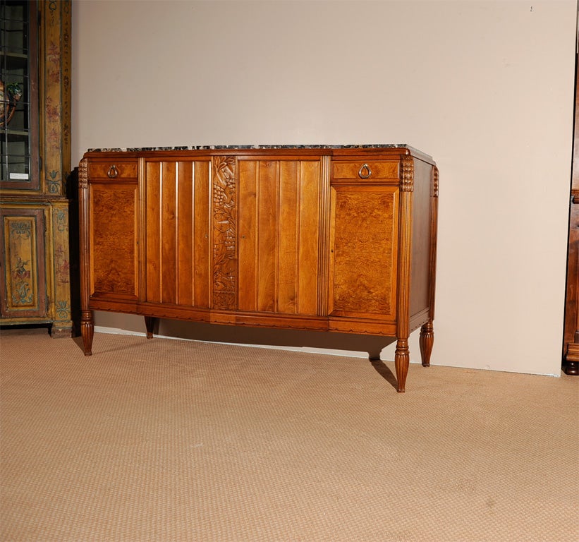 French period Art Deco carved walnut two-door buffet with Breche Orientale de Baixas marble top and carved walnut mirrored backsplash. Labeled 