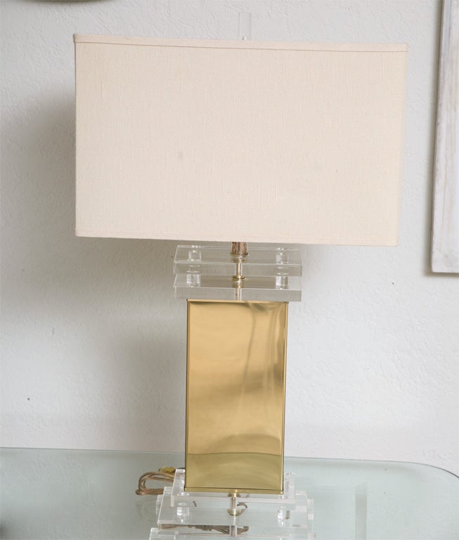 Clean, classic, 70's lamps are simple brass boxes mounted on stacked lucite bases, with original lucite finials. (Shades not included - Display Only.)