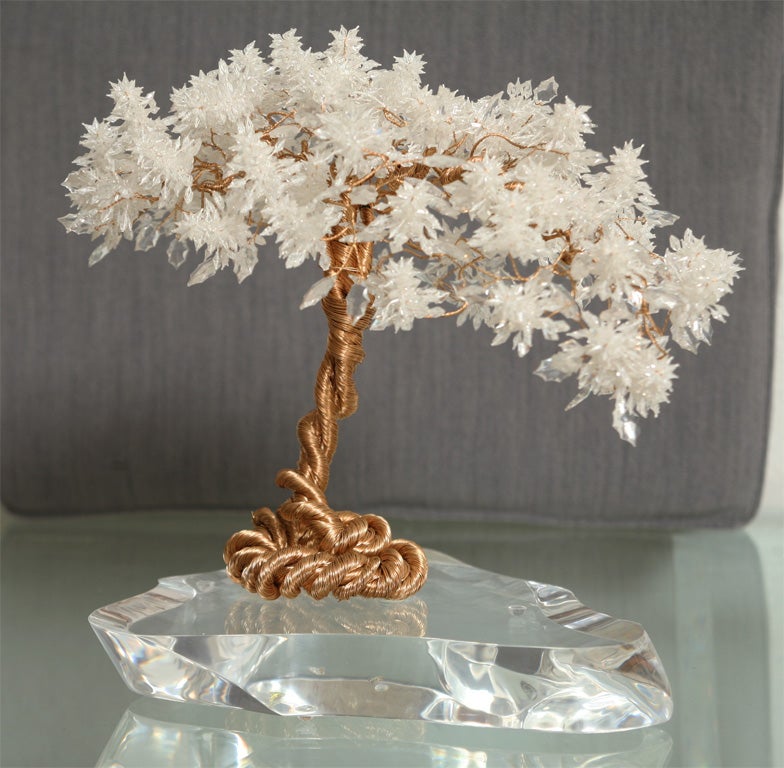 Beacuse we all need a little touch of modern glamour ...this sweet-as-could-be 70's tree sculpture is crafted of twisted brass wire ending in a profusion of faceted acrylic beads, mounted on a lucite base. Signed, simply 