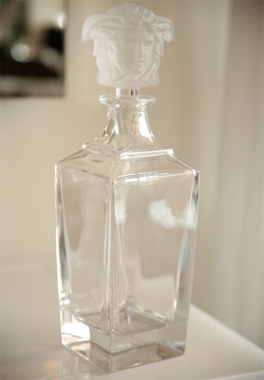 Thick heavy glass decanter with frosted glass stopper--fits snugly to preserve the contents. Fabulous for serving.