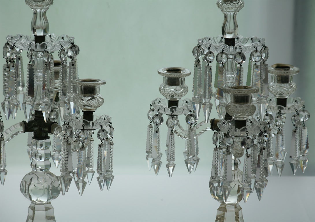 This is an unusual pair of cut crystal candelabra in amazing condition. They are substantial but read on the diminutive side, elegant and highly decorative. With four candles lit, they reflect and refract the light like sparkling stars!<br />
The
