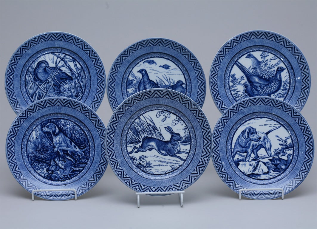 This amazing set of 12 blue and white transfer dinner plates depicts six different scenes including the rabbit, pheasant, duck and two with dogs. The colors are crisp with great contrast and definition. This is a rare set in unusually excellent