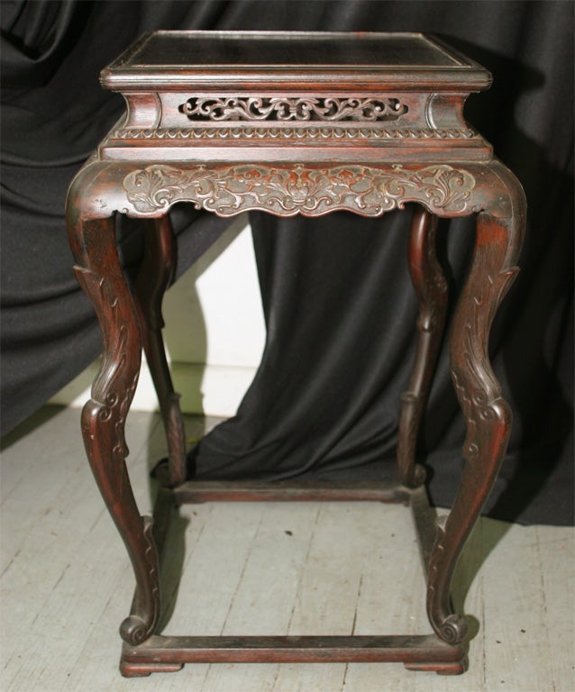 Chinese Carved Rosewood (Hongmu) Incense or Flower Pedestal.  Shown with Relief-Carved Leafy Vine Meanders on the Apron. The Scrolled Feet at the Base of the Graceful Cabriolet Legs end Attached to a Floor Stretcher