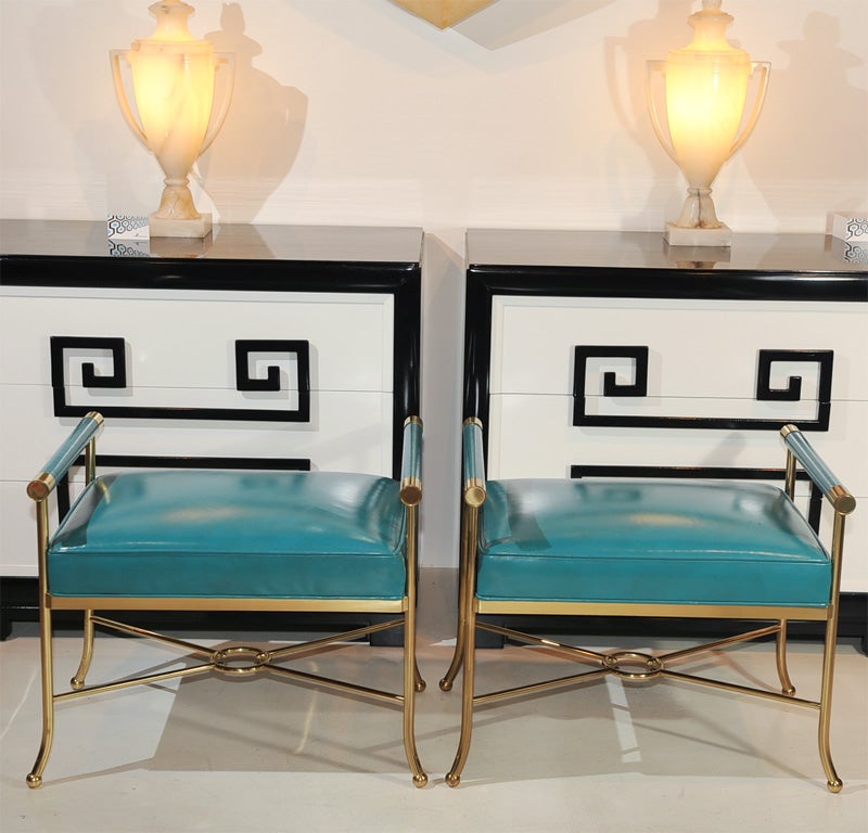 Pair of neoclassical style brass benches upholestered in original turqoise leather.