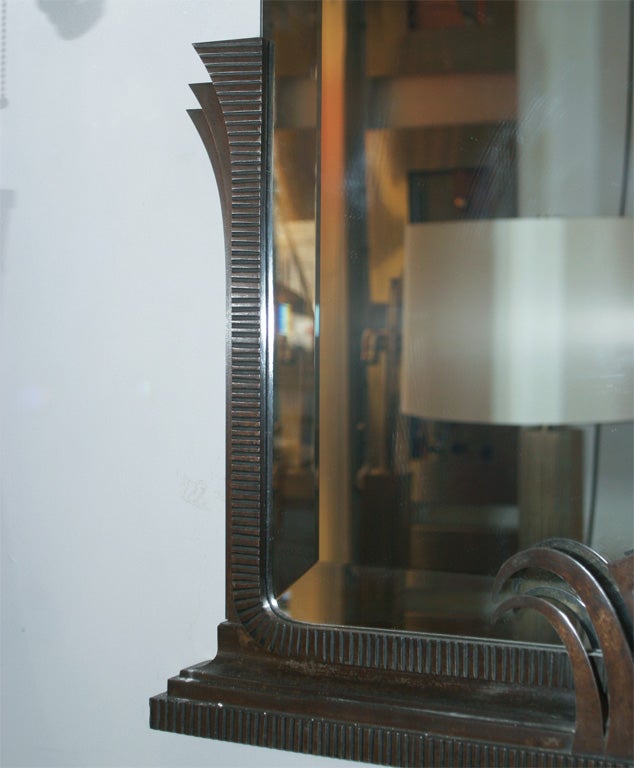 An Art Deco iron mirror by Jules Bouy.