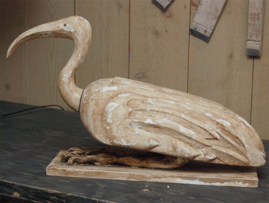 Attractively hand carved figure on an Ibis.<br />
The center of the back opens.