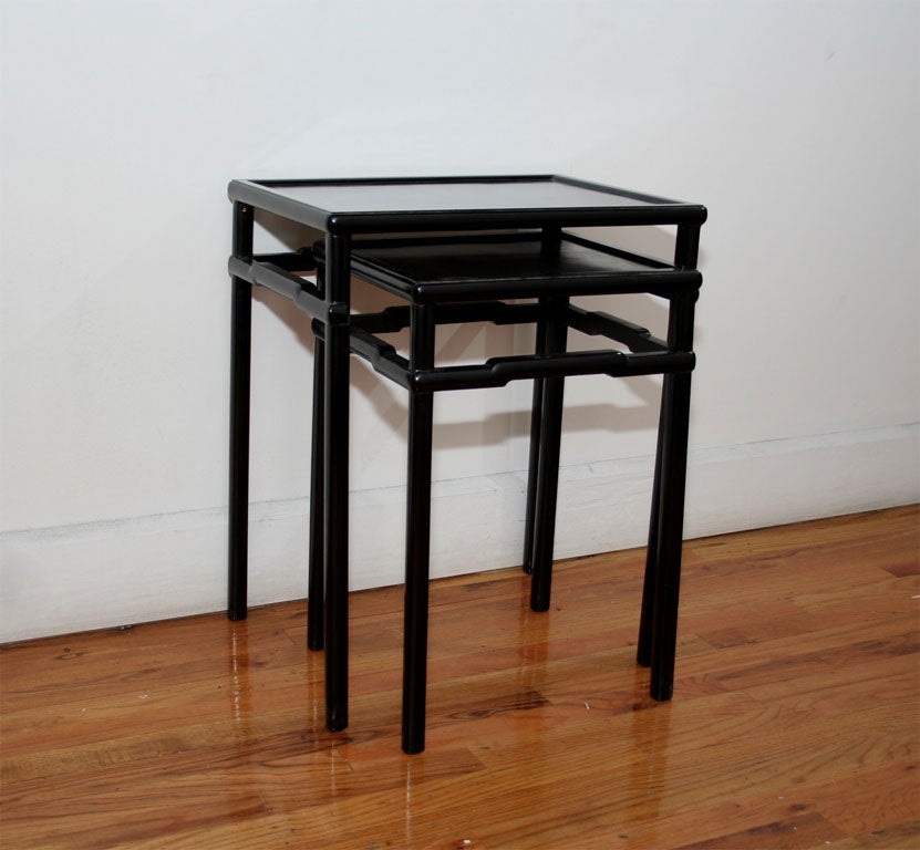 Two ebonized stacking tables in Chinese style.