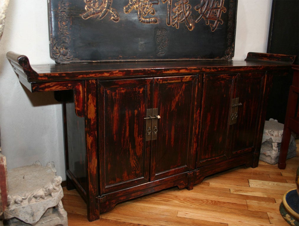 Chinese Qing Dynasty elmwood altar coffer console cabinet, with its original untouched deep red lacquer surface and hardware. Great interior space for use as a entertainment unit for a flat screen