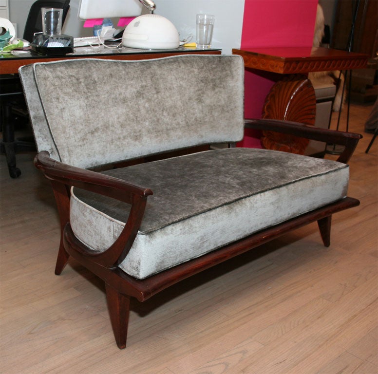 Elegant settee in the manner of Leon Jallot. Mahogany frame with velvet upholstery.