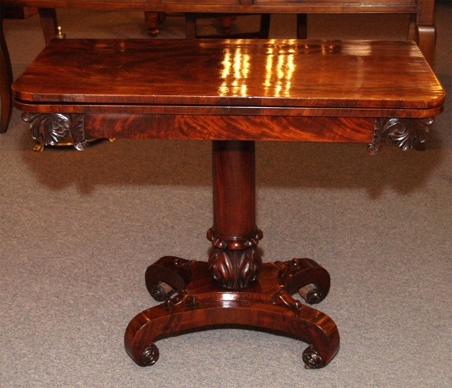 Antique English mahogany fold-over tea table.