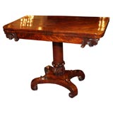 Antique English mahogany fold-over tea table.