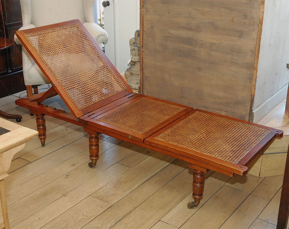 A Mahogany Campaign or Day Bed Lounge with Cane Top and Brass Castors