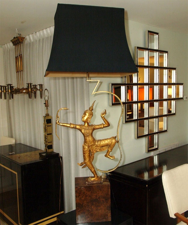 Very large, heavy, table lamp with gilt solid bronze figure resting on a burl veneer base; Custom silk lined and black silk shade. Measurements include the shade.