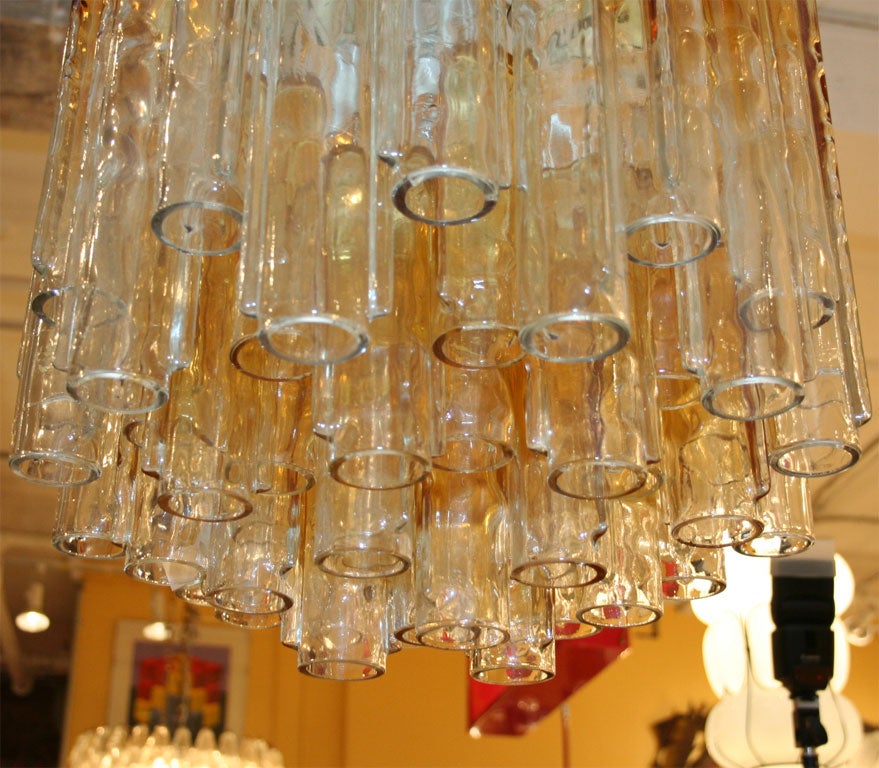 Multi-tiered chandelier by Paolo Venini with calze crystals. The crystals are amber and fade down the length to clear.  Beautiful! Located at ABC Home 646-602-3519.