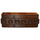 Hand carved dresser with distressed finish and carved elements.