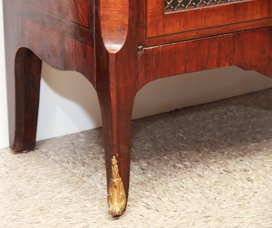 A LOUIS XV-XVI STYLE BOOKCASE-CABINET. FRENCH, C. 1880-90