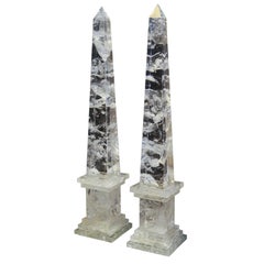 A PAIR OF NEOCLASSIC STYLE ROCK CRYSTAL OBELISKS.