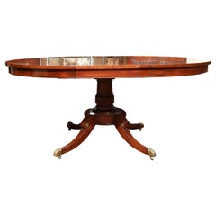 A REGENCY STYLE EXTENDING DINING TABLE. AMERICAN, C. 1940