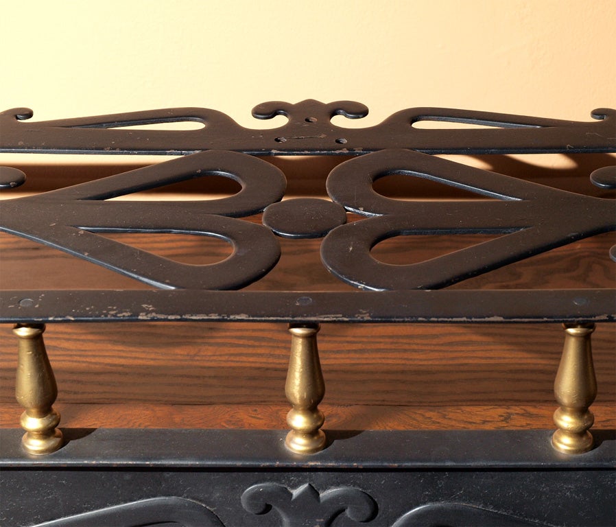 Antique English brass and iron trivet fender.