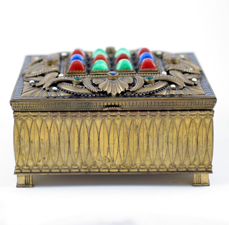 Beautifully executed Jewelry Box. Enamel floral details with sugar Loaf form and faceted semi precious stones on lid.  Not signed.