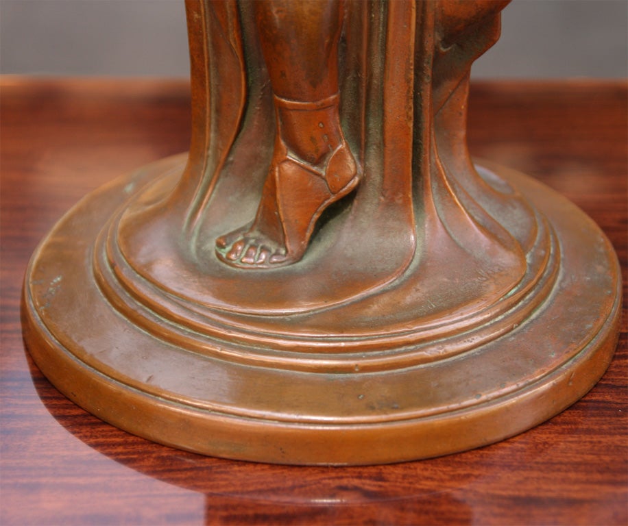 Stylized bronze lamp with<br />
elements of both Art Deco and<br />
Art Nouveau in the design.<br />
Lamp features sculpted man<br />
and woman, along with an<br />
owl and a crescent moon<br />
above.  Signed.