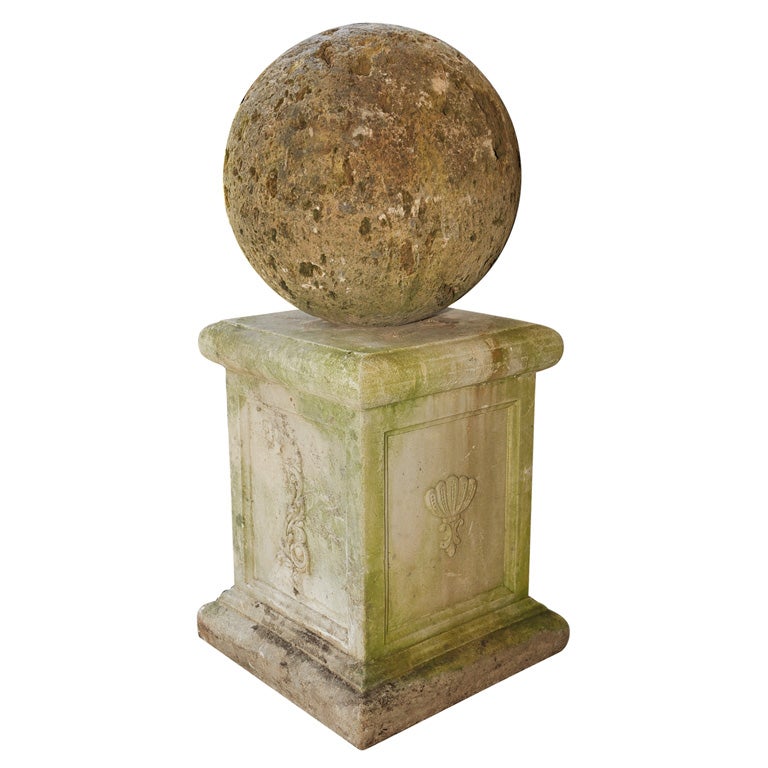 A Stone Sphere on Stone Plinth