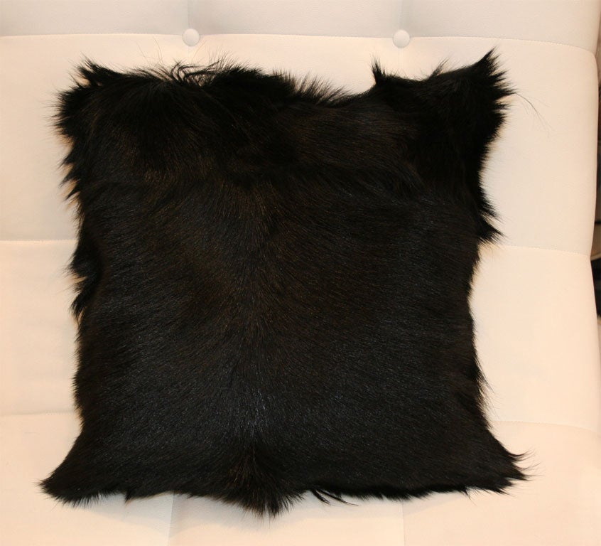 Goat fur pillow, white or black. We also make goat fur rugs, $45 per sq. ft.